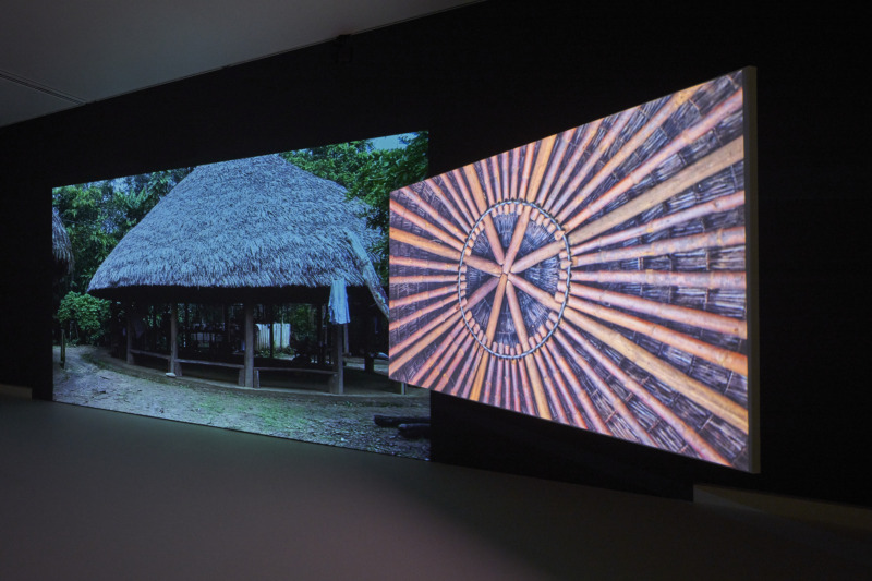 Installation view: Ursula Biemann & Paulo Tavares: Forest Law, 2014, two-channel video installation, maps, documents, objects, publications, dimensions variable, Courtesy Ursula Biemann, Paulo Tavares, photo: Norbert Miguletz